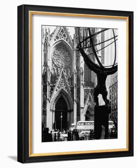 Entrance to St. Patrick's Visible Across Fifth Avenue, with Atlas Statue Silhouetted in Foreground-Andreas Feininger-Framed Photographic Print