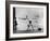 Erik Flensted Jensen, Coach of Danish Gymnastic Team, Watching as Three Men Perform-Gjon Mili-Framed Photographic Print