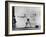 Erik Flensted Jensen, Coach of Danish Gymnastic Team, Watching as Three Men Perform-Gjon Mili-Framed Photographic Print