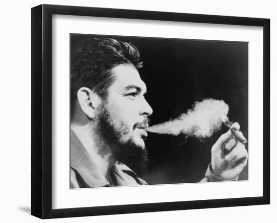 Ernesto 'Che' Guevara Exhaling Plume of Cigar, NYC, 1964-null-Framed Photo