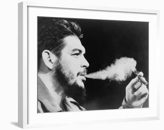 Ernesto 'Che' Guevara Exhaling Plume of Cigar, NYC, 1964-null-Framed Photo