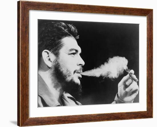 Ernesto 'Che' Guevara Exhaling Plume of Cigar, NYC, 1964-null-Framed Photo