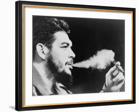 Ernesto 'Che' Guevara Exhaling Plume of Cigar, NYC, 1964-null-Framed Photo