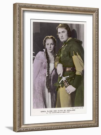 Erroll Flynn as Robin and Olivia de Havilland as Maid Marian in "The Adventures of Robin Hood" 1938-null-Framed Art Print