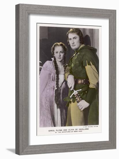 Erroll Flynn as Robin and Olivia de Havilland as Maid Marian in "The Adventures of Robin Hood" 1938-null-Framed Art Print