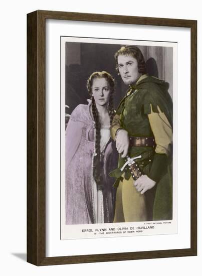 Erroll Flynn as Robin and Olivia de Havilland as Maid Marian in "The Adventures of Robin Hood" 1938-null-Framed Art Print
