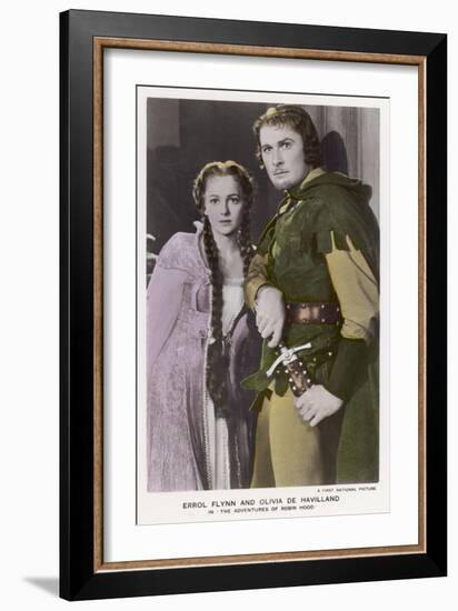 Erroll Flynn as Robin and Olivia de Havilland as Maid Marian in "The Adventures of Robin Hood" 1938-null-Framed Art Print