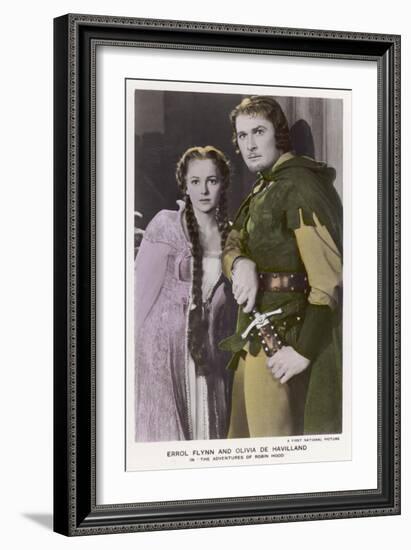 Erroll Flynn as Robin and Olivia de Havilland as Maid Marian in "The Adventures of Robin Hood" 1938-null-Framed Art Print