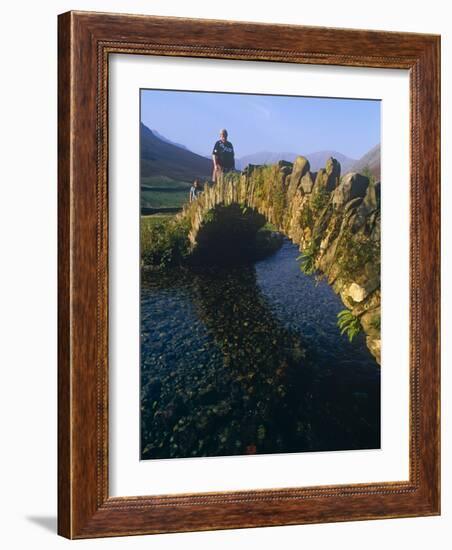 Eskdale, Cumbria, Walkers Crossiing a Tradition Stone Bridge-Paul Harris-Framed Photographic Print