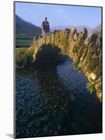 Eskdale, Cumbria, Walkers Crossiing a Tradition Stone Bridge-Paul Harris-Mounted Photographic Print