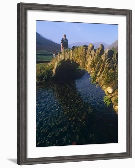 Eskdale, Cumbria, Walkers Crossiing a Tradition Stone Bridge-Paul Harris-Framed Photographic Print