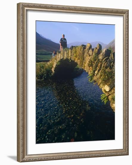 Eskdale, Cumbria, Walkers Crossiing a Tradition Stone Bridge-Paul Harris-Framed Photographic Print