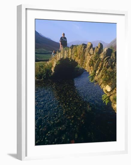 Eskdale, Cumbria, Walkers Crossiing a Tradition Stone Bridge-Paul Harris-Framed Photographic Print