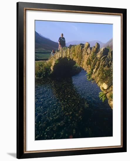Eskdale, Cumbria, Walkers Crossiing a Tradition Stone Bridge-Paul Harris-Framed Photographic Print