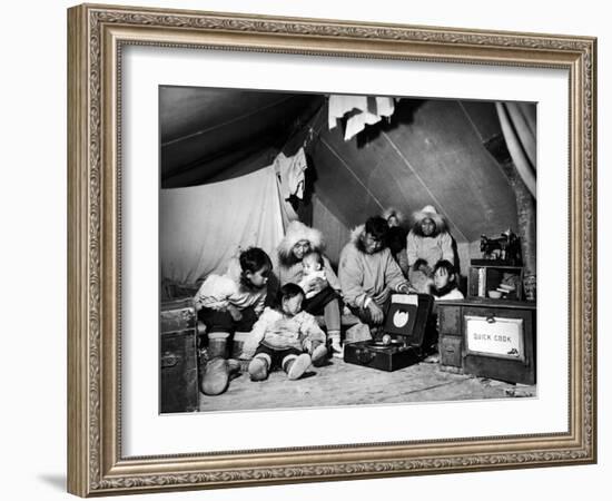 Eskimo Family Admiring their Modern Conveniences, a Victrola, a Sewing Machine and a Stove-Margaret Bourke-White-Framed Photographic Print