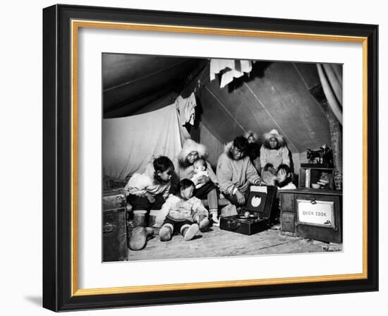 Eskimo Family Admiring their Modern Conveniences, a Victrola, a Sewing Machine and a Stove-Margaret Bourke-White-Framed Photographic Print