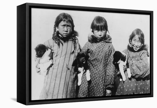 Eskimo Girls with Husky Puppies Photograph - Alaska-Lantern Press-Framed Stretched Canvas