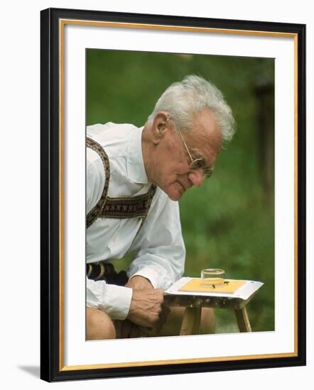 Ethologist Karl Von Frisch Testing the Ability of Bees to Perceive Color in His Home Garden-Nina Leen-Framed Premium Photographic Print