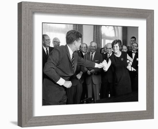 Eunice Shriver Receives a Signing Pen from Her Brother, President John Kennedy-null-Framed Photo