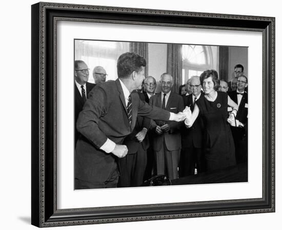 Eunice Shriver Receives a Signing Pen from Her Brother, President John Kennedy-null-Framed Photo