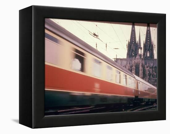 Eurailpass in Europe: Germany's Parsifal Express Speeding Past Cologne Cathedral-Carlo Bavagnoli-Framed Premier Image Canvas