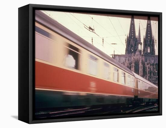 Eurailpass in Europe: Germany's Parsifal Express Speeding Past Cologne Cathedral-Carlo Bavagnoli-Framed Premier Image Canvas