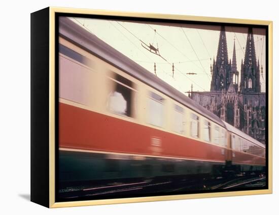 Eurailpass in Europe: Germany's Parsifal Express Speeding Past Cologne Cathedral-Carlo Bavagnoli-Framed Premier Image Canvas