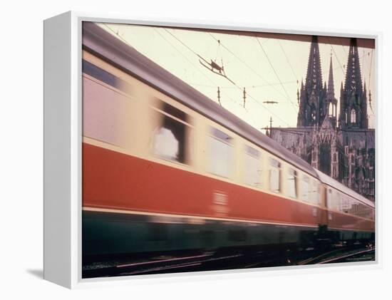Eurailpass in Europe: Germany's Parsifal Express Speeding Past Cologne Cathedral-Carlo Bavagnoli-Framed Premier Image Canvas