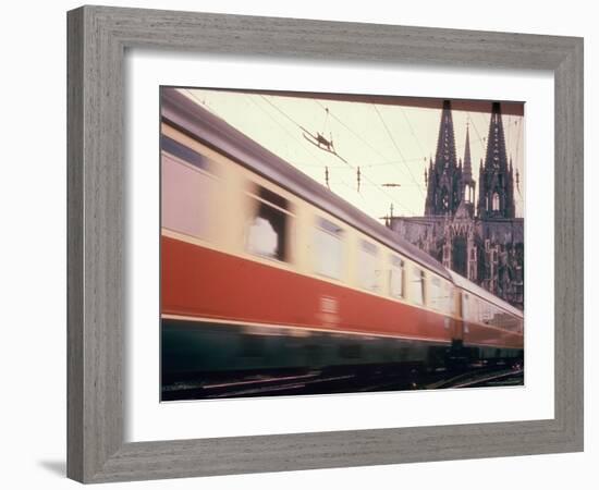 Eurailpass in Europe: Germany's Parsifal Express Speeding Past Cologne Cathedral-Carlo Bavagnoli-Framed Photographic Print