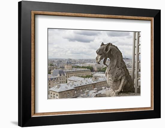 Europe, France, Paris. A gargoyle on the Notre Dame Cathedral.-Charles Sleicher-Framed Photographic Print