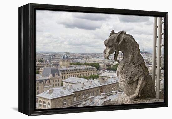 Europe, France, Paris. A gargoyle on the Notre Dame Cathedral.-Charles Sleicher-Framed Premier Image Canvas