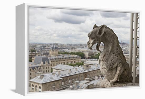 Europe, France, Paris. A gargoyle on the Notre Dame Cathedral.-Charles Sleicher-Framed Premier Image Canvas