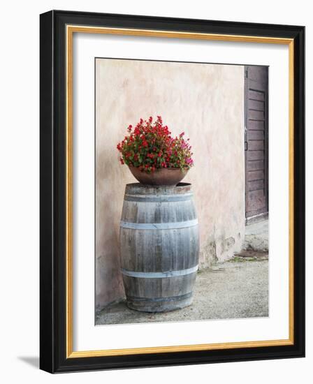 Europe, Italy, Tuscany. Flower Pot on Old Wine Barrel at Winery-Julie Eggers-Framed Photographic Print