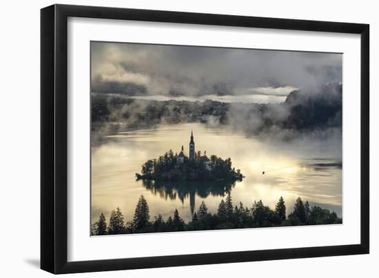 Europe, Slovenia, Bled - A Pletna Boat Arriving At The Island Of Lake Bled During A Foggy Sunrise-Aliaume Chapelle-Framed Photographic Print