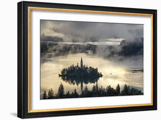 Europe, Slovenia, Bled - A Pletna Boat Arriving At The Island Of Lake Bled During A Foggy Sunrise-Aliaume Chapelle-Framed Photographic Print