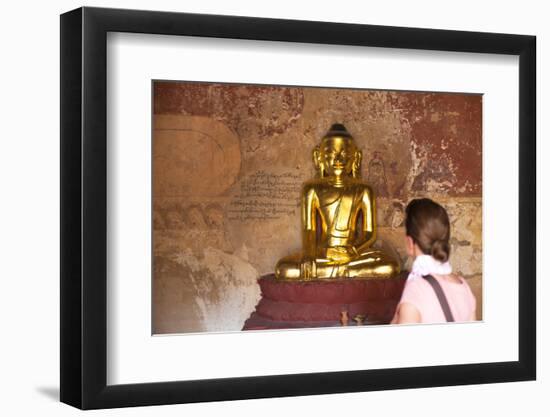 European Tourist Looking at Golden Buddha Statue in Bagan, Myanmar-Harry Marx-Framed Photographic Print