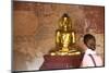European Tourist Looking at Golden Buddha Statue in Bagan, Myanmar-Harry Marx-Mounted Photographic Print