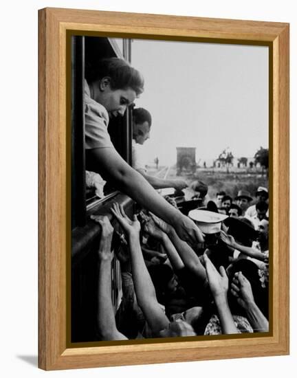 Eva Peron, Wife of Argentinean Presidential Candidate, Passing Out Campaign Buttons-Thomas D^ Mcavoy-Framed Premier Image Canvas