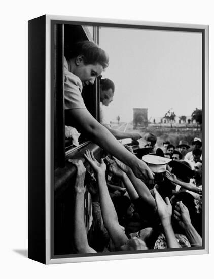 Eva Peron, Wife of Argentinean Presidential Candidate, Passing Out Campaign Buttons-Thomas D^ Mcavoy-Framed Premier Image Canvas