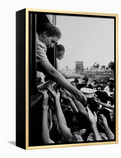 Eva Peron, Wife of Argentinean Presidential Candidate, Passing Out Campaign Buttons-Thomas D^ Mcavoy-Framed Premier Image Canvas