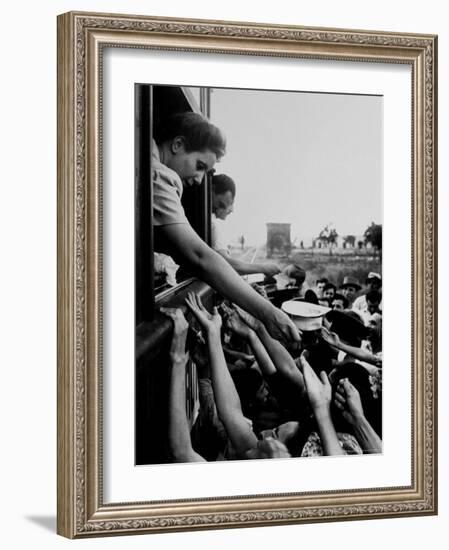 Eva Peron, Wife of Argentinean Presidential Candidate, Passing Out Campaign Buttons-Thomas D^ Mcavoy-Framed Premium Photographic Print