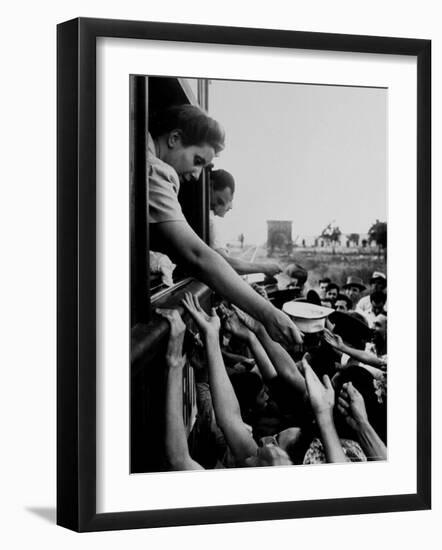 Eva Peron, Wife of Argentinean Presidential Candidate, Passing Out Campaign Buttons-Thomas D^ Mcavoy-Framed Premium Photographic Print