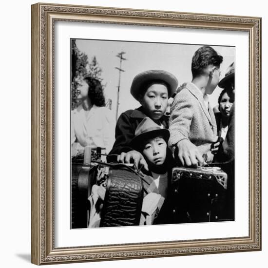 Evacuees of Japan Awaiting Turn for Baggage Inspection upon Arrival at Assembly Center During WWII-Dorothea Lange-Framed Photographic Print