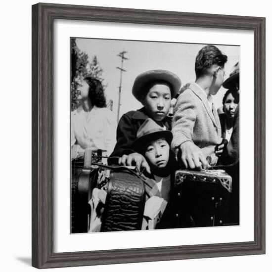 Evacuees of Japan Awaiting Turn for Baggage Inspection upon Arrival at Assembly Center During WWII-Dorothea Lange-Framed Photographic Print