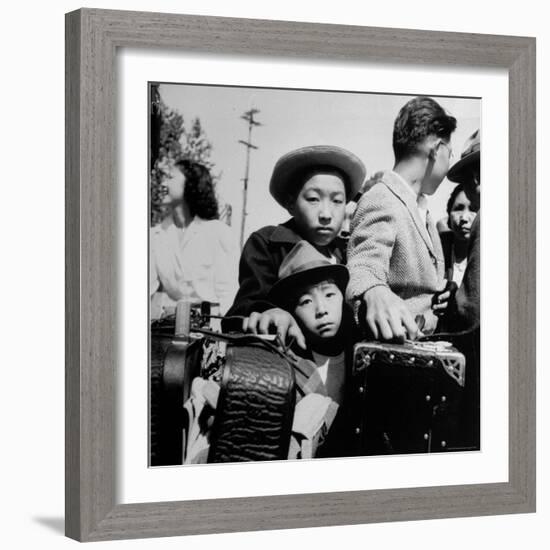 Evacuees of Japan Awaiting Turn for Baggage Inspection upon Arrival at Assembly Center During WWII-Dorothea Lange-Framed Photographic Print