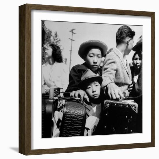 Evacuees of Japan Awaiting Turn for Baggage Inspection upon Arrival at Assembly Center During WWII-Dorothea Lange-Framed Photographic Print