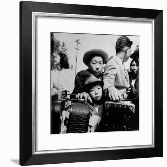 Evacuees of Japan Awaiting Turn for Baggage Inspection upon Arrival at Assembly Center During WWII-Dorothea Lange-Framed Photographic Print