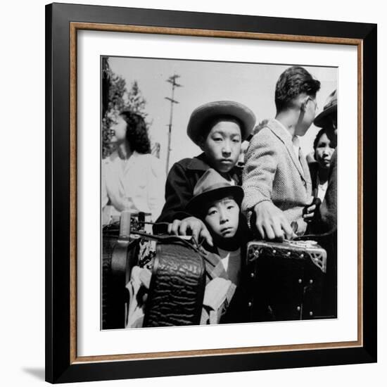 Evacuees of Japan Awaiting Turn for Baggage Inspection upon Arrival at Assembly Center During WWII-Dorothea Lange-Framed Photographic Print