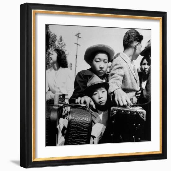 Evacuees of Japan Awaiting Turn for Baggage Inspection upon Arrival at Assembly Center During WWII-Dorothea Lange-Framed Photographic Print