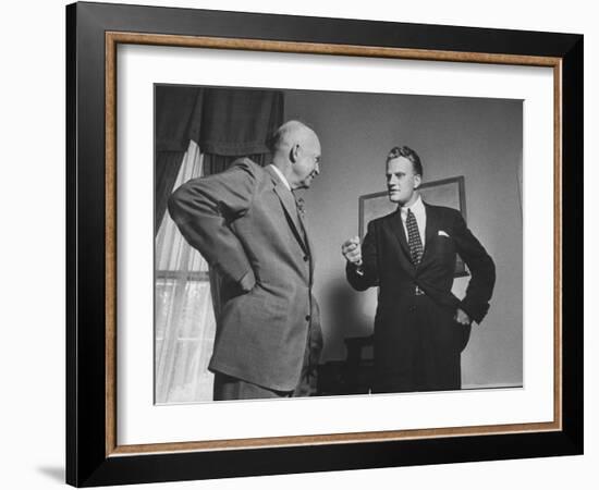 Evangelist Billy Graham Visiting with Pres. Dwight Eisenhower at the Wh-Paul Schutzer-Framed Photographic Print